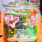 Glass jar with decorative elements on a table